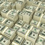 Stacks of hundred dollar bills representing casino bonus winnings